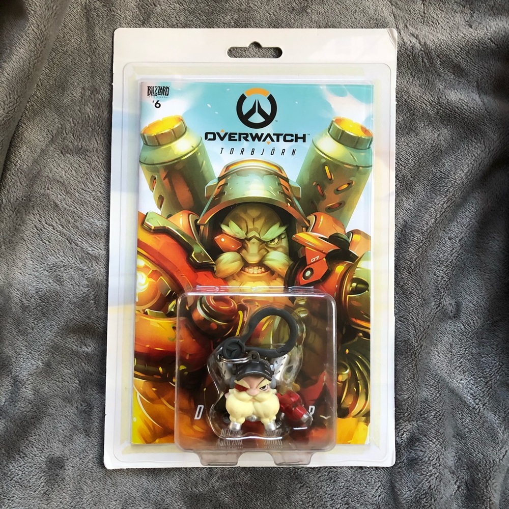 Overwatch Torbjörn Keychain and comic book